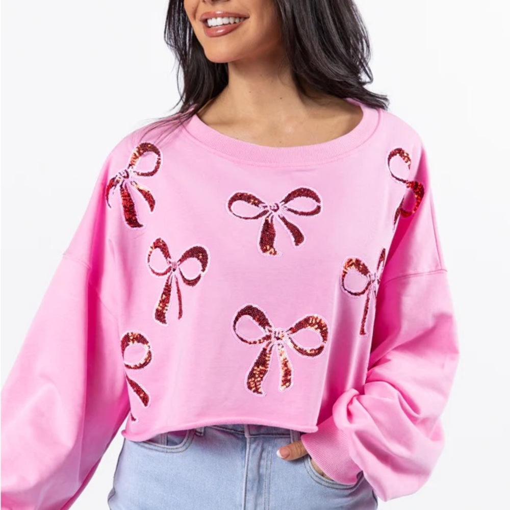 Brand new Pink Lily pink sweater with sequin bows